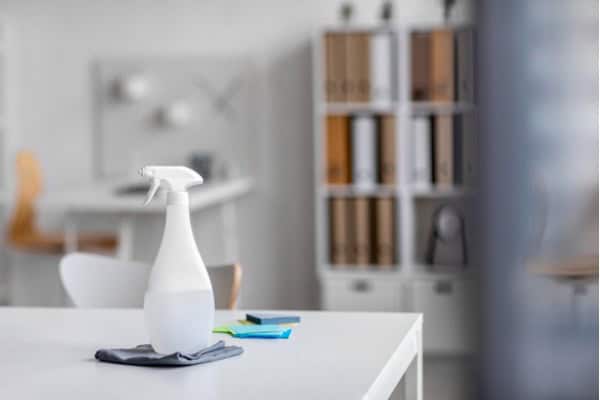 a cleaning spray bottle on a wooden surface