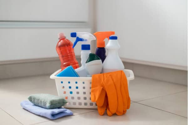 a bunch of cleaning supplies and tools in a basket with sponge and cleaning cloth