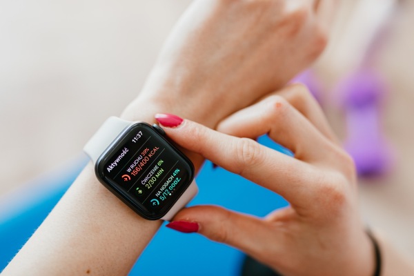 closeup of wrist with fitness tracker showing burned calories