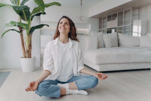 a woman in clean room practicing yoga
