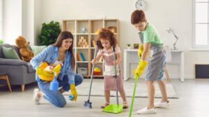 Mother, son and daughter are cleaning house