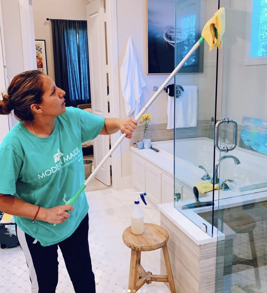 A Modern Maids cleaner performing a house cleaning